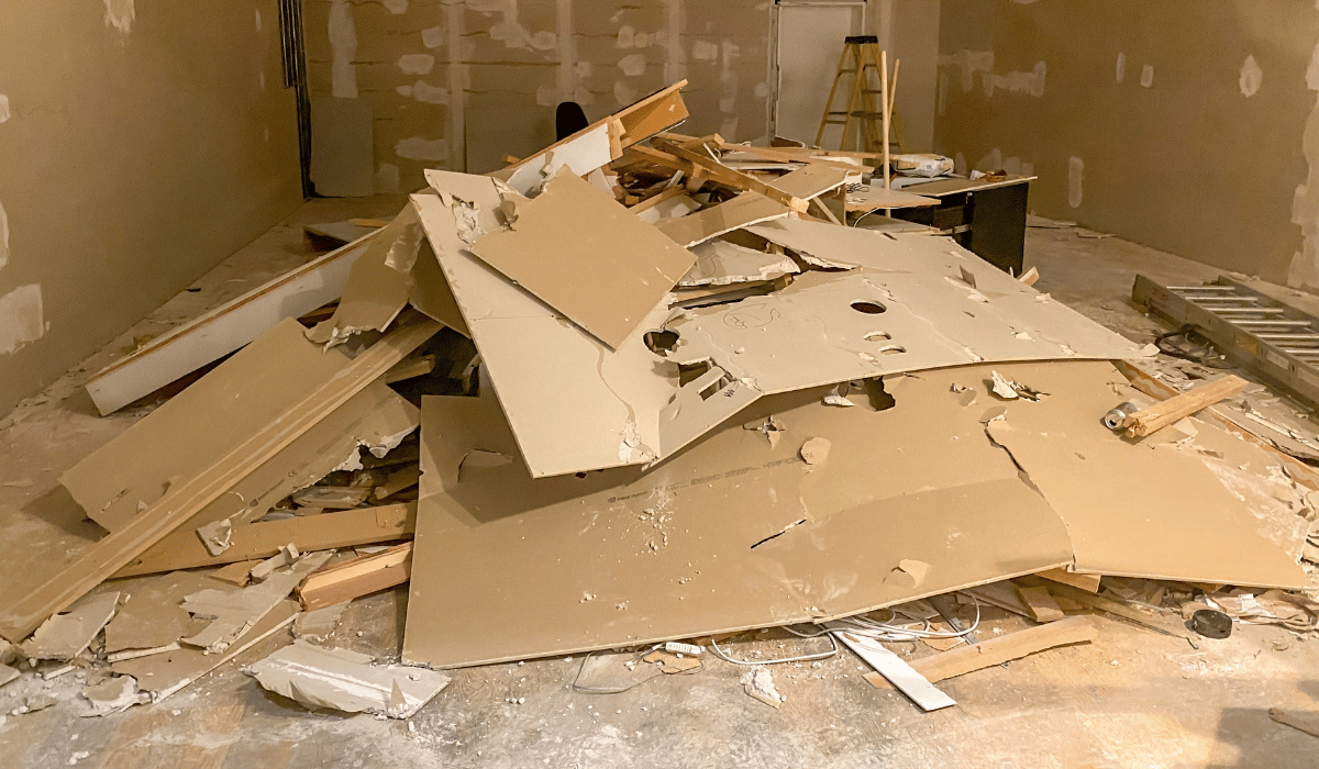 dismantling drywall before garbage removal